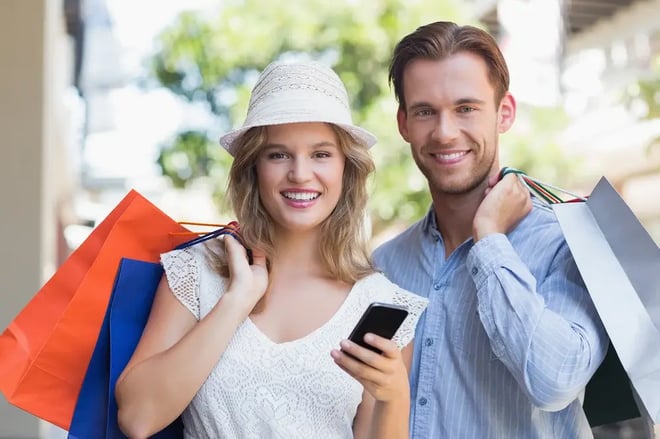 cute-couple-holding-shopping-bags